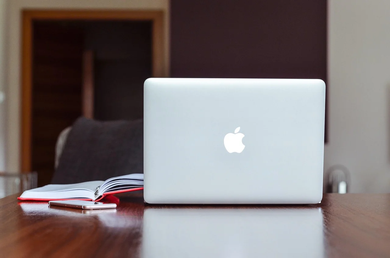Technical SEO audit workspace with laptop and notes